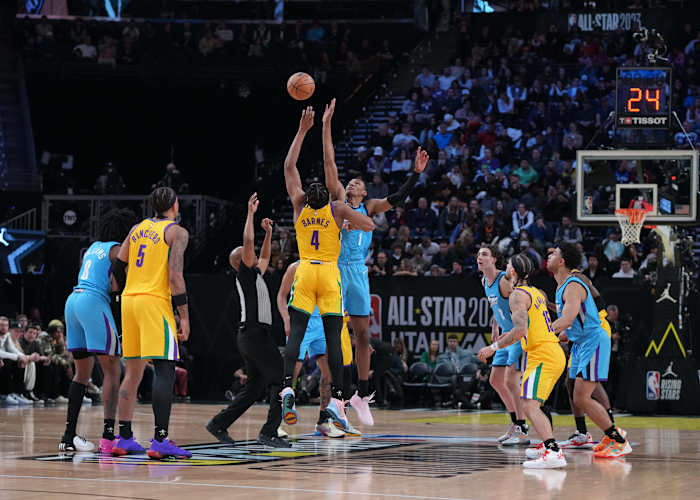 Team Pau forward Scottie Barnes (4) goes up for the opening tip against Team Joakim forward Jabari Smith Jr. (1) in the finals of the 2023 NBA All Star Rising Stars Game at Vivint Arena